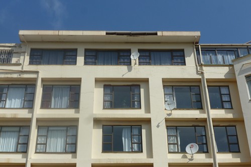 Asbestos concrete panels falling off roof