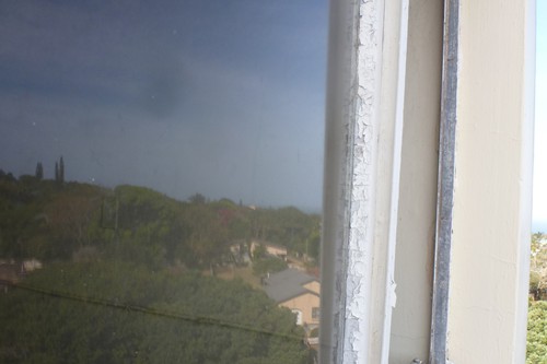 Old putty breaking up allows glass pane to fall out